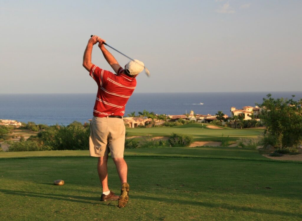 Male Caucasian Golfer Swinging in Mexico